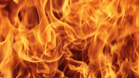 Intense fire flames burning on black background creating dramatic cinematic.. Stock Footage 337337251