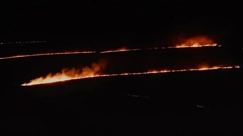 Intense Flames Against the Calm Dark Sky. Aerial Drone Shot. Stock Footage 257762266