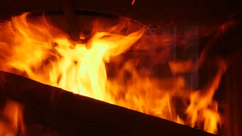 Intense flames break out in the fireplace. Slow motion 4K Video stock 171881137