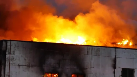 Intense flames burning building Stock Footage 115980925