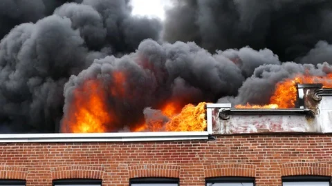 Intense flames burning structure Stock Footage 114946182
