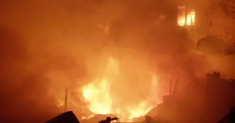 Intense flames fire inferno in poor settlement Stock Footage 65824906