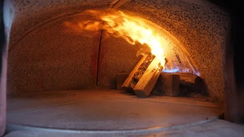 Intense Flames Inside a Traditional Wood-Fired Italian Pizza Oven [1] Stock Footage 337676555