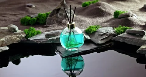 Intense fragrance diffuser on a lunar landscape with small pond. Stock Footage 333047882