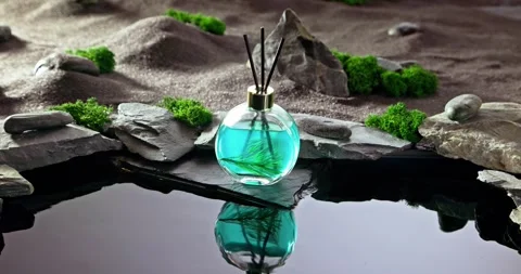 Intense fragrance diffuser on a lunar landscape with small pond. Stock Footage 335599871