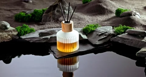 Intense fragrance diffuser on a lunar landscape with small pond. Stock Footage 337072846