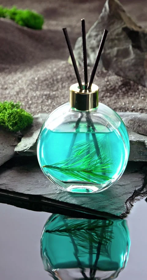 Intense fragrance diffuser on a lunar landscape with small pond. Stock Footage 347558093