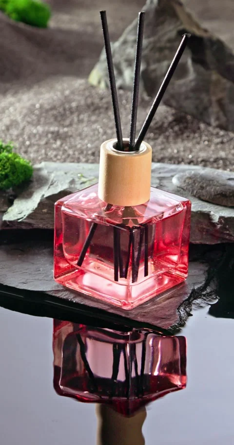 Intense fragrance diffuser on a lunar landscape with small pond. Stock Footage 348083033