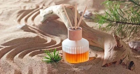 Intense fragrance diffuser on sandy beach in summer. Stock Footage 334001230