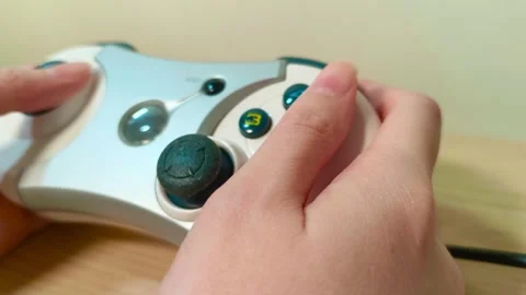 Intense gaming action with a handheld controller, feel the thrill of competition Video stock 318310866
