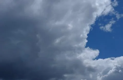 Intense grey cloudscape cover blue sky outside. Background, place for text Stock Photos