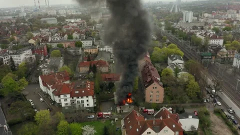 Intense House Fire Scene With Firemen Battling Flames Smoke From Rooftop View Stock Footage 315351314