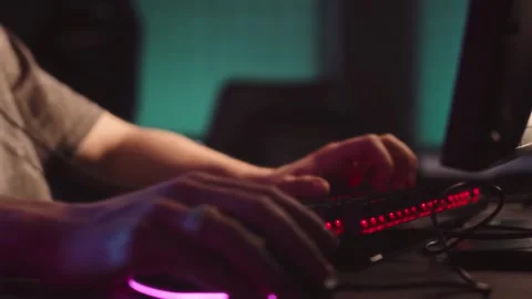 Intense Late-Night Gaming Setup with Glowing RGB Lights Stock Footage 320912441