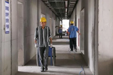 Intense Looking Construction Worker Carry Wheelbarrow Stock Photos