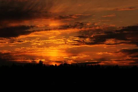 Intense Orange Sky at Sunset Stock Photos