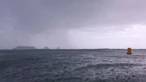 Intense Rain Curtains Over distant Islands Видео 331154378