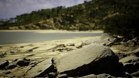 Intense scene of windblown sands and ominous clouds over rocky terrain Stock Footage 341590359
