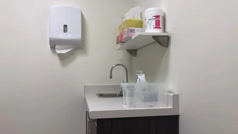 Intense side shot of a sink and counter in a hospital room. Stock Footage 103639161