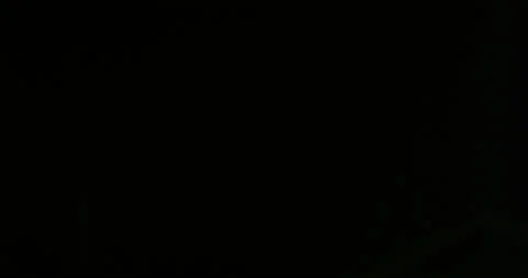 Intense, single-flash of lighting illuminates a thunderhead. 스톡 동영상 320333518