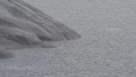 Intense summer rainstorm spattering surface of Rock and Northern Wisconsin lake. Stock Footage 205020514