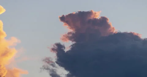 Intense summer Sunset grazing Cumulus Cloud Top changes to look like squirrel Video stock 211359352