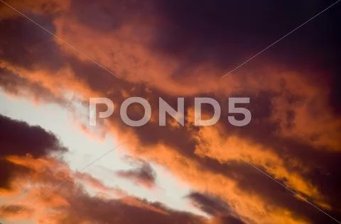Intense sunset clouds Stock Photos