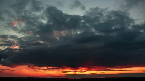 Intense sunset with many dark clouds Stock Footage 153210091