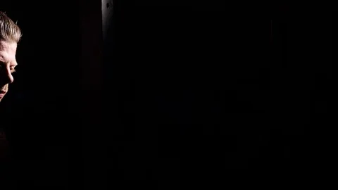 Intense sweaty dramatic portrait of young muscular tired man resting after a Video stock 74341077