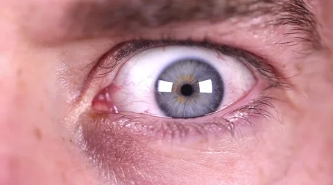 Intense terrified eye close up, blue male eye, scared, angry emotions, terrified Stock Footage 44943010