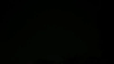 Intense thunderstorm with lightning in the clouds in Night sky just after a Video stock 337505620