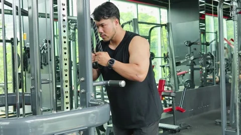 Intense Tricep Workout with Rope Pulldown in Gym Stock Footage 328565433
