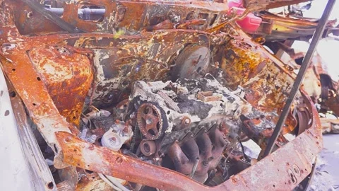 Intense video of a rusty car with exposed engine, showcasing tense atmosphere Stock Footage 274572452
