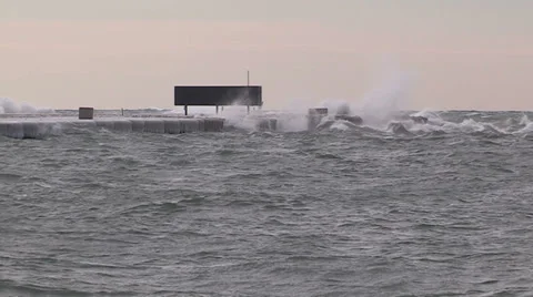 Intense waves rolling in and breaking during storm with hurricane force winds Stock Footage 36657009