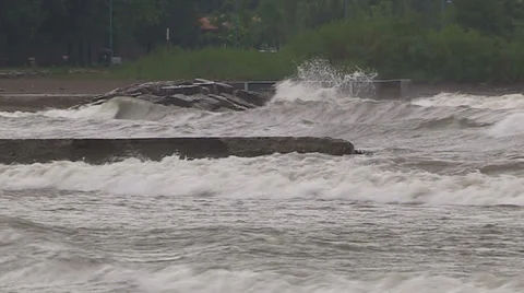 Intense waves rolling in and breaking during storm with hurricane force winds Stock Footage 37186588