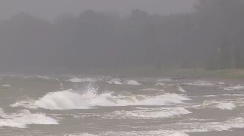 Intense waves rolling in and breaking during storm with hurricane force winds Stock Footage 40248423