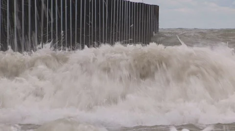 Intense waves rolling in and breaking during storm with hurricane force winds Stock Footage 40311170