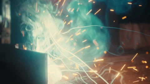Intense welding arc with sparks and smoke during metal fabrication slow motion Stock Footage 331900222