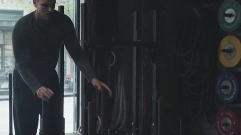 Intense workout pushing sled Stock Footage 76724548