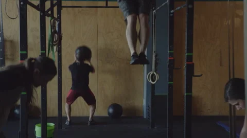 Intense workout session featuring various gym exercises for all levels Stock Footage 312706495