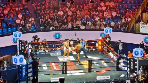 Intensity Unleashed: Thrilling Muay Thai Fight in Bangkok Stock Footage 240873681