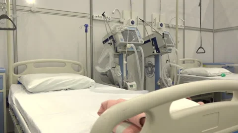 Intensive care bed with ventilator for Covid-19 patient in clinic with Stock Footage 170673227
