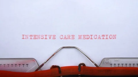 Intensive care medication - phrase printed on an old typewriter, red letters Stock-Footage 128399459