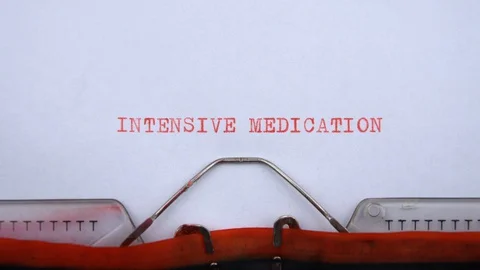 Intensive medication - phrase printed on an old typewriter in red letters Video stock 128399572
