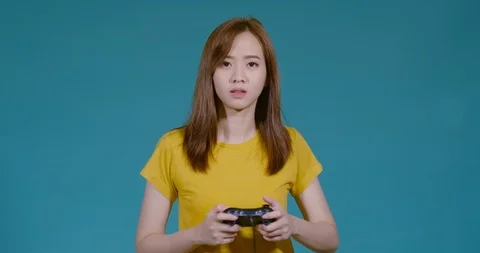 Intent Gamer E-sport of young asian woman playing games with joystick Video stock 126468772