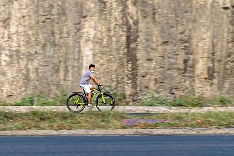 Intentional camera movement, Motion blur, panning image of a bicycle rider on Stock Photos