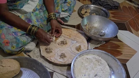 The intentional rhythm of hand pleating that exceeds basic culinary preparation  Stock Footage 345505967