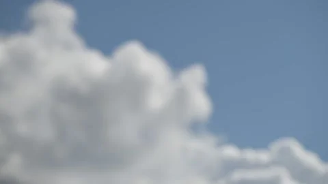 Intentionally blurred image of white fluffy clouds on a clear sunny day Vídeos de archivo 150627933