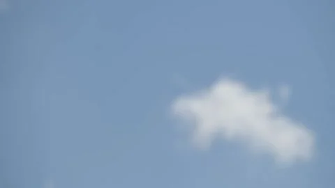 Intentionally blurred image of white fluffy clouds on a clear sunny day Видео 150627975