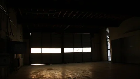 Intentionally shaky shot inside dark garage Stock Footage 95111499