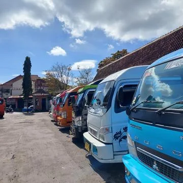 Inter-city mini bus parked neatly at the terminal Stock Photos